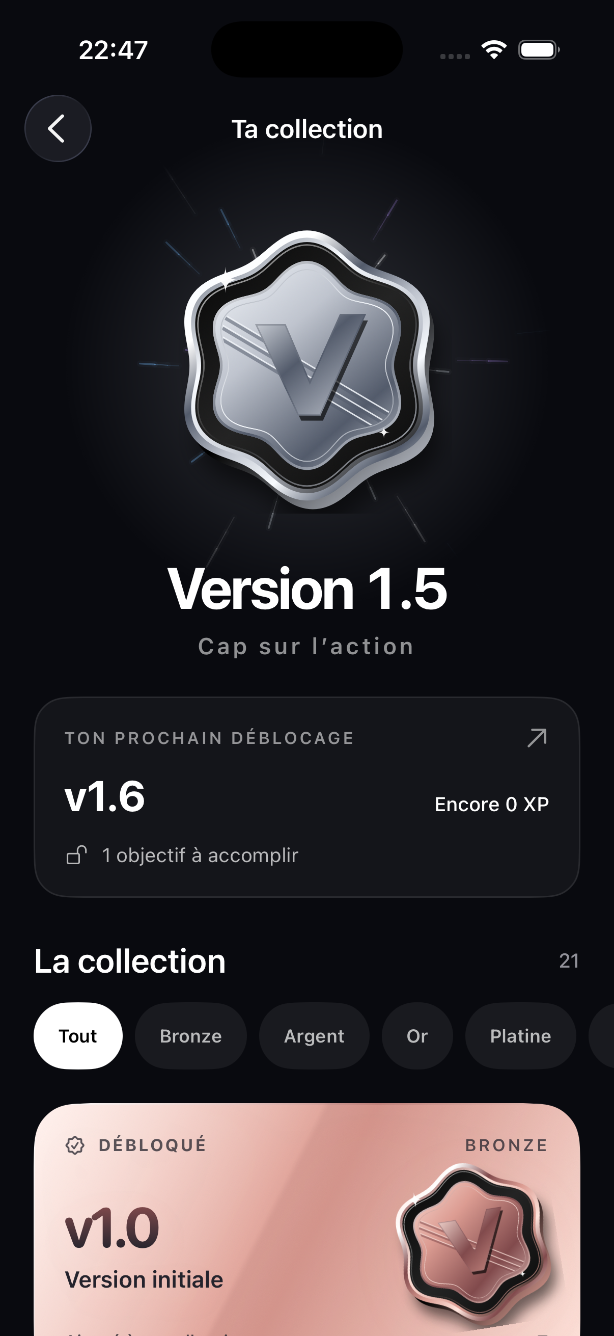 Écran de progression de Version 2.0 : collection de badges et prochain objectif